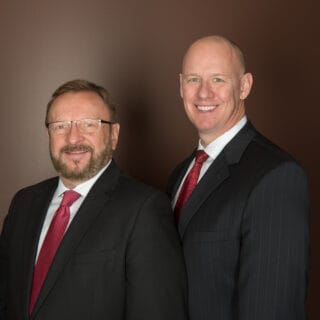 Partners Wayne Messmer (left) and James Geake (right)