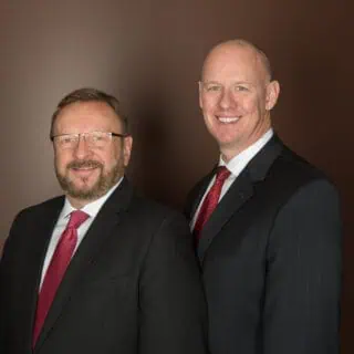 Partners Wayne Messmer (left) and James Geake (right)